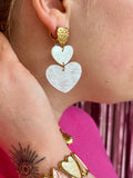 Boucles d’oreilles pendantes cœur blanc